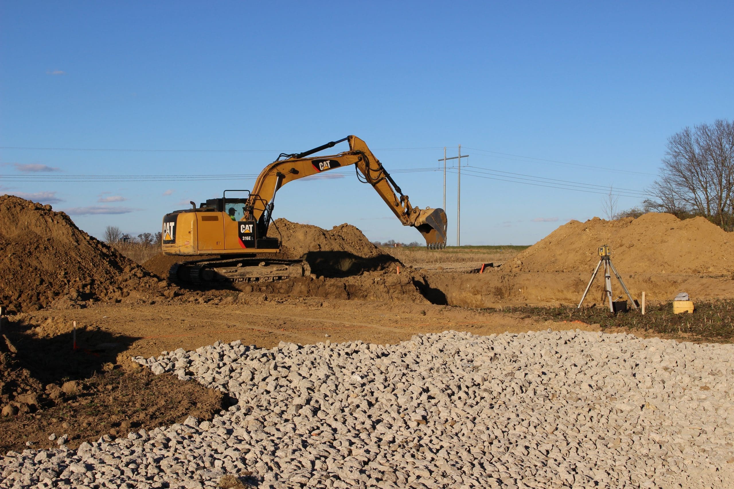 Image of backhoe digging a footer.